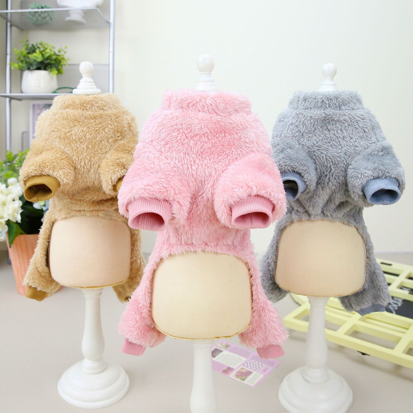 Image featuring a selection of stylish small dog clothes, showcasing trendy pet clothing options for your furry friend.