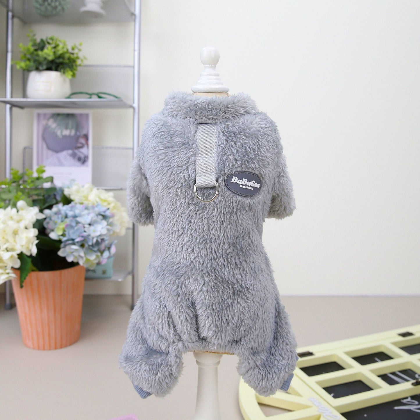 Image featuring a selection of stylish small dog clothes, showcasing trendy pet clothing options for your furry friend.