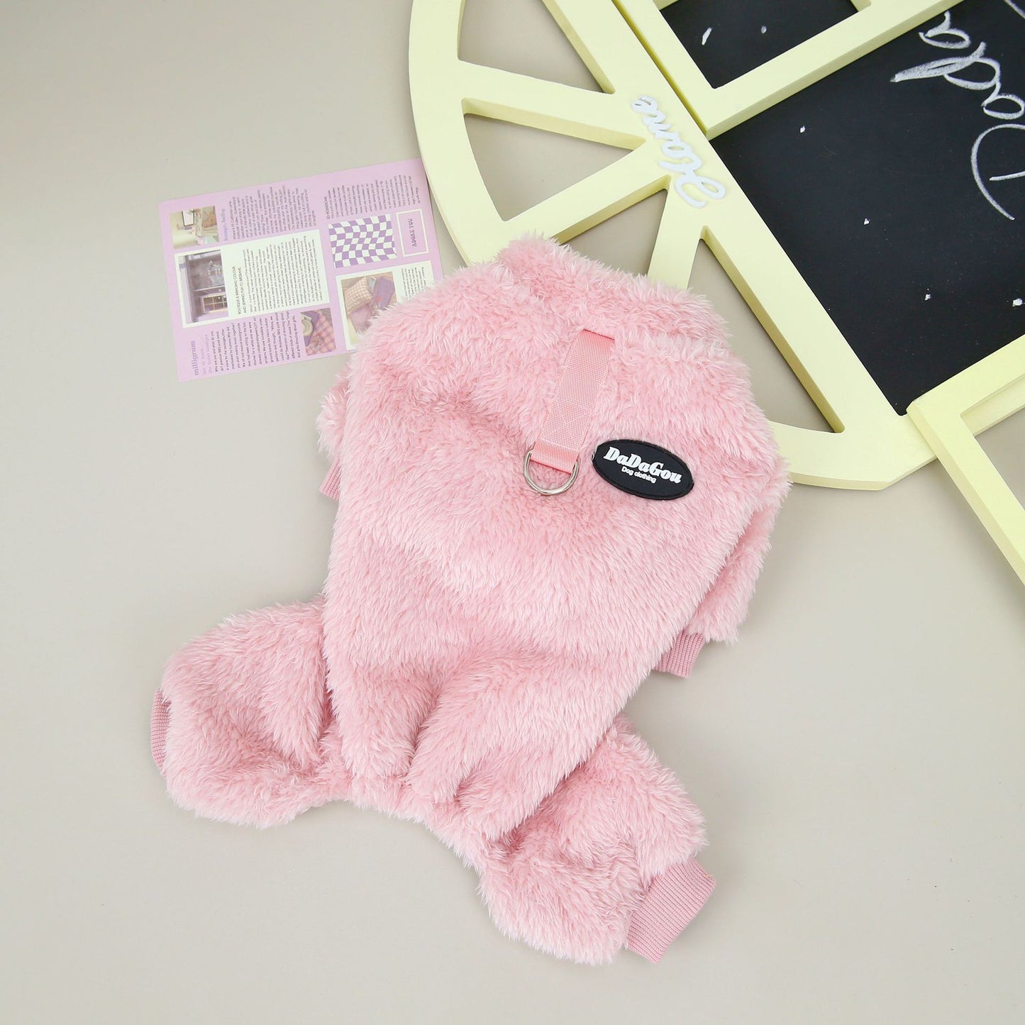 Image featuring a selection of stylish small dog clothes, showcasing trendy pet clothing options for your furry friend.